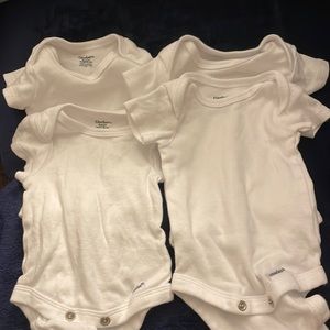 7 NB white onesies